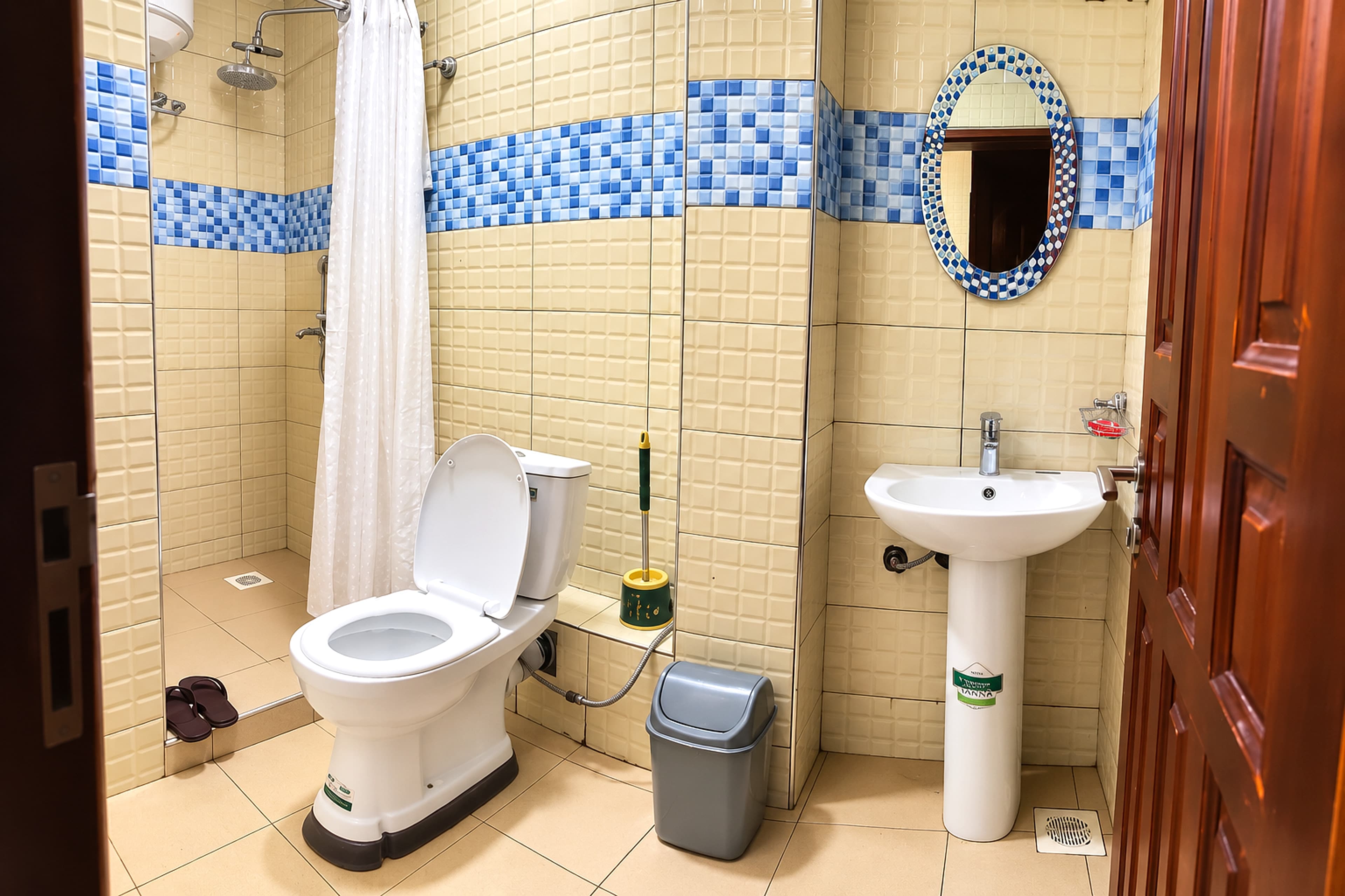Freshly kept guest bathroom at Royal Hotel Apartments